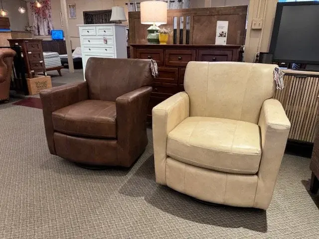 Pair of Caroly top-grain leather swivel glider chairs