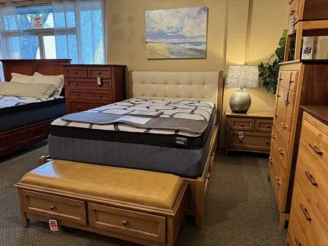 McKenzie upholstered bed frame finished in pecan